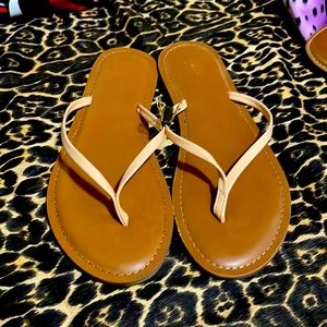 Tan/peach flip flops